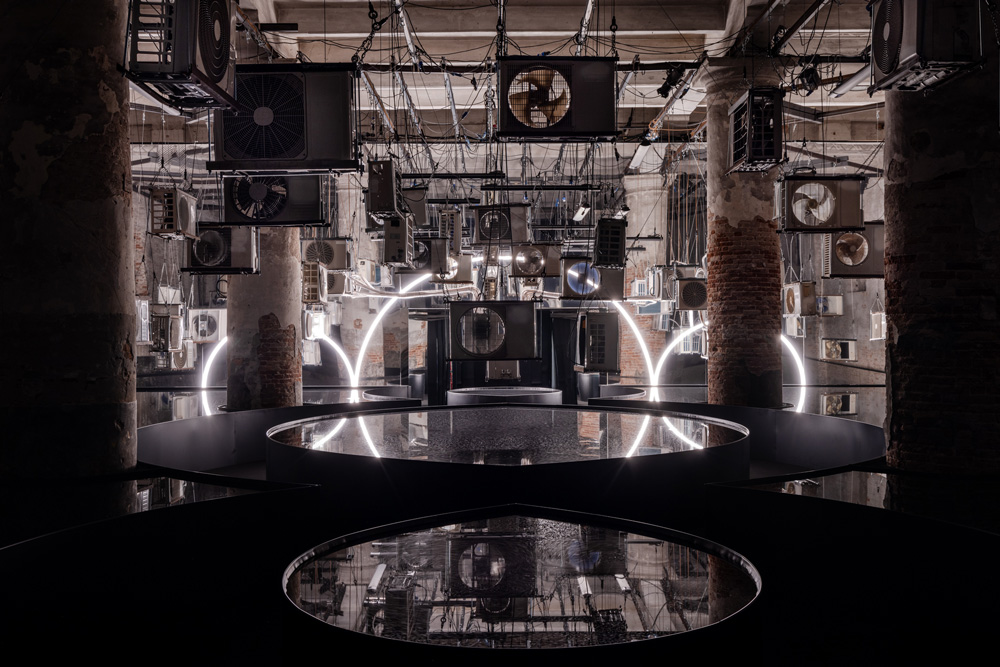Dark room with hanging air conditioners.